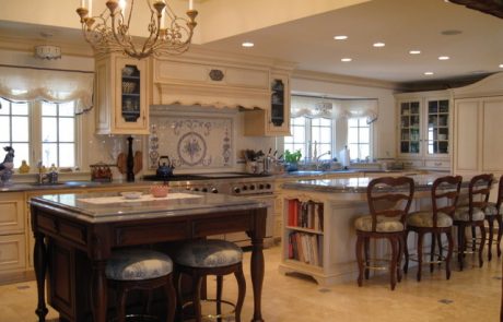 Designs by Dolores - Large kitchen with designed tile as stove backsplash