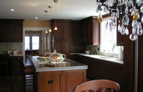 Designs by Dolores - Dark cabinets and floors with light grey counters
