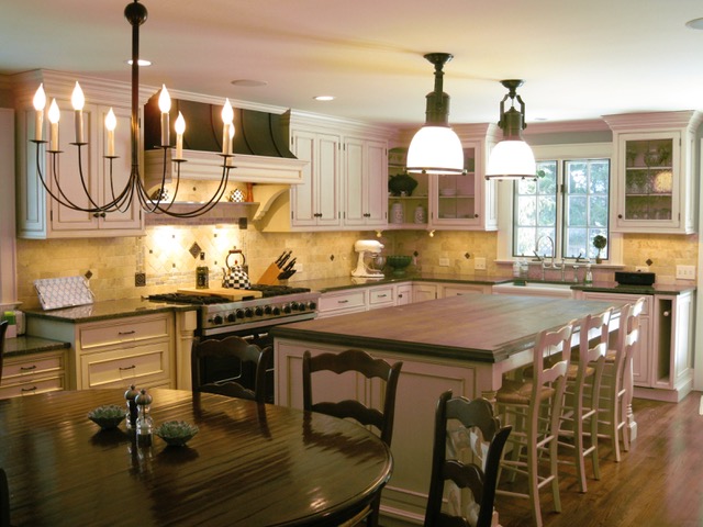 Designs by Dolores - White cabinetry kitchen with large center bar