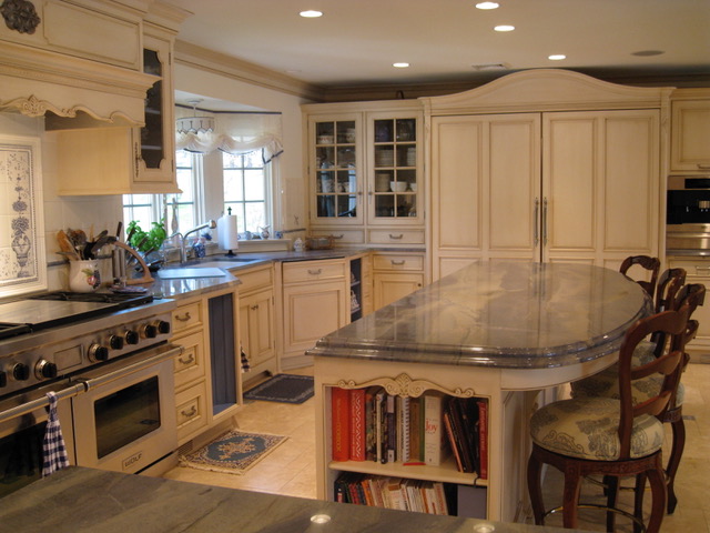 Designs by Dolores - Large kitchen with center bar with built in shelving