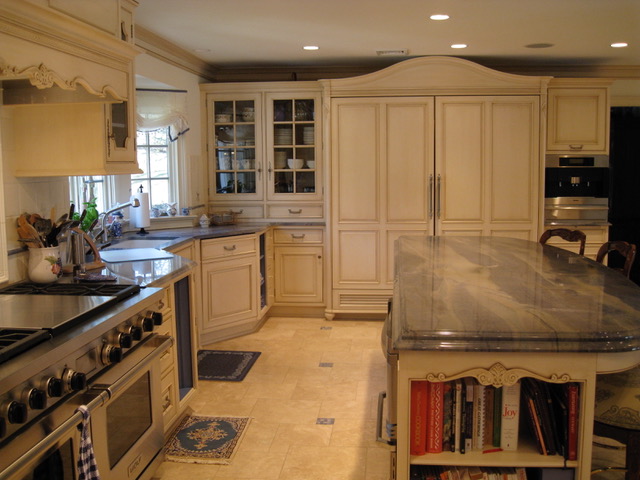 Designs by Dolores - Large kitchen with designed tile as stove backsplash and large built in fridge