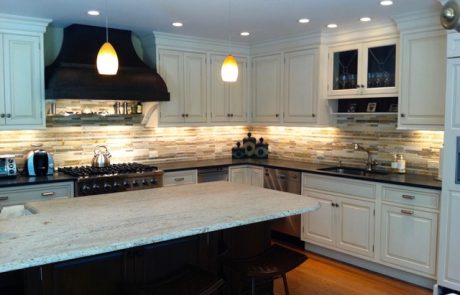 Designs by Dolores - White kitchen cabinetry with tiled backsplash