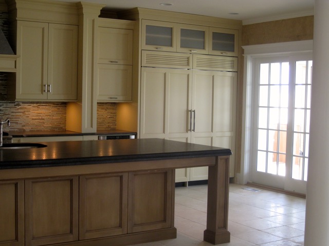 Designs by Dolores - Natural Kitchen Cabinets with large bar