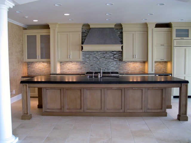 Designs by Dolores - Natural kitchen cabinets with large bar