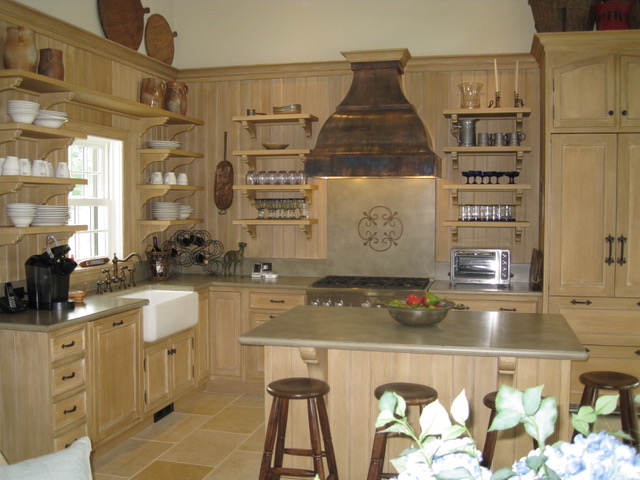 Designs by Dolores - Natural finish cabinets with unique rustic stove vent