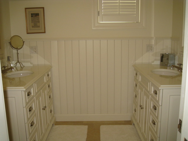 Designs by Dolores - Bathroom with white cabinets and counters and sinks on opposing sides