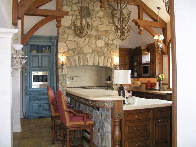 Designs by Dolores - Stone Kitchen with white counters and dark luxury trim